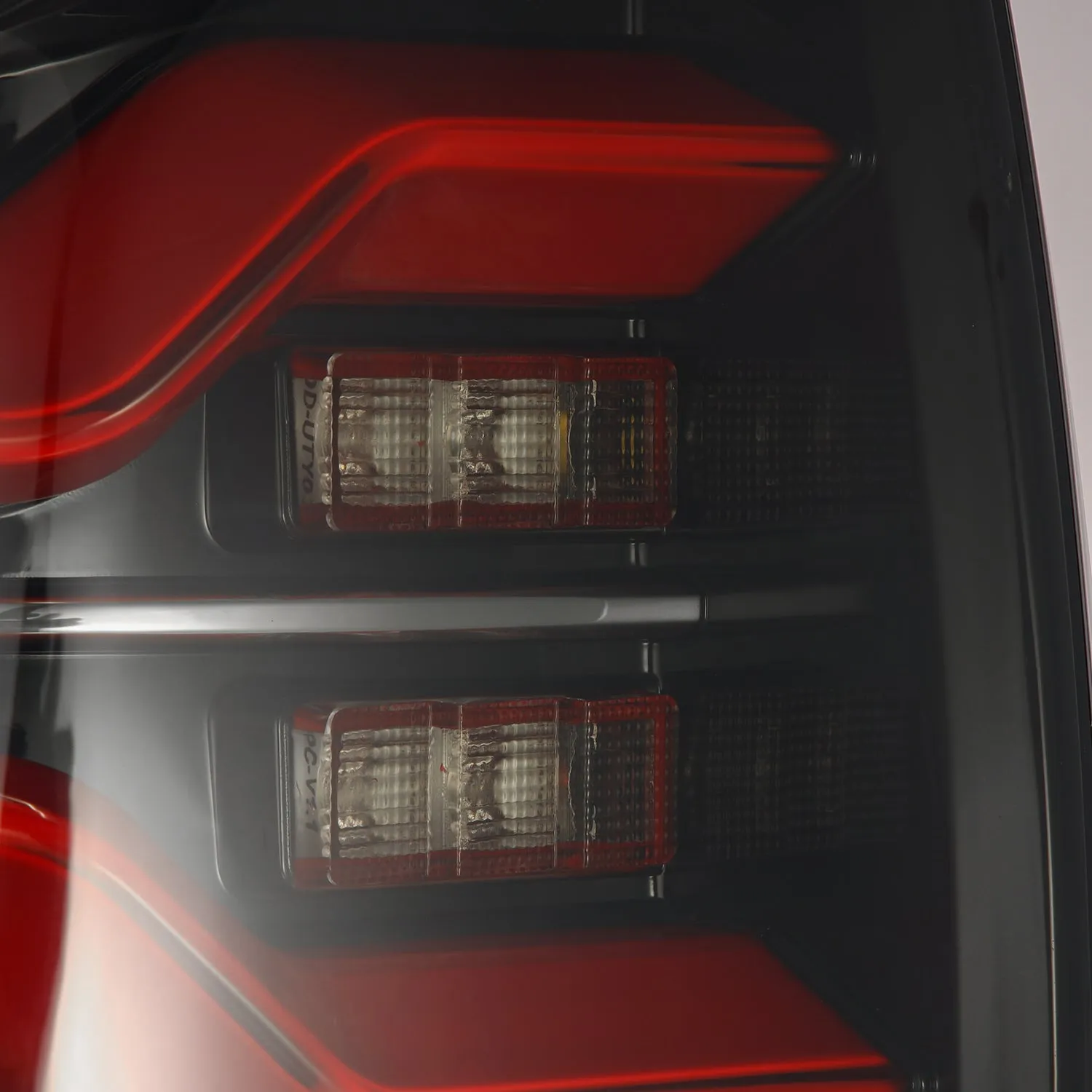 AlphaRex 16-21 Toyota Tacoma LUXX LED Taillights Blk/Red w/Activ Light/Seq Signal (arx680000)